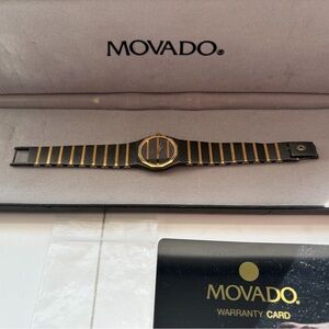 Movado Black and Gold Timepiece